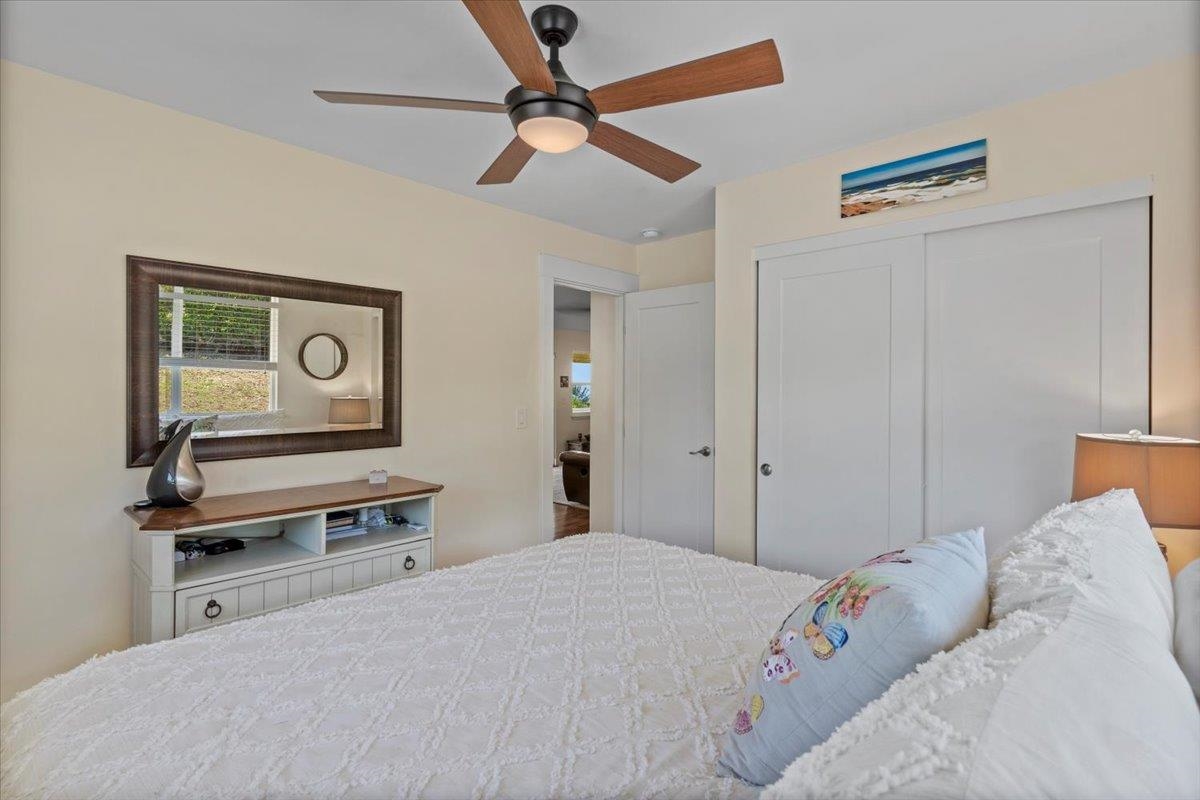 139 Pauwela Road Haiku, HI 96708 - Photo 21 of 42 a bedroom with a bed and a dresser