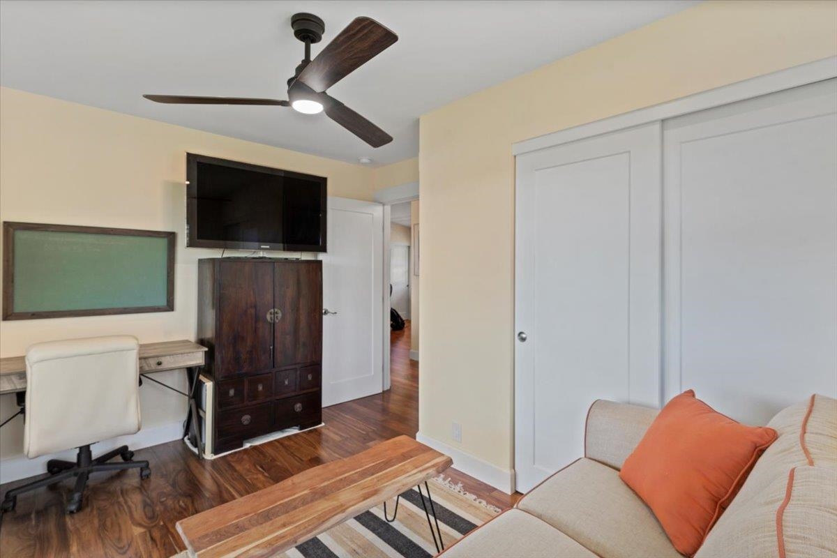 139 Pauwela Road Haiku, HI 96708 - Photo 25 of 42 a living room with furniture and a flat screen tv