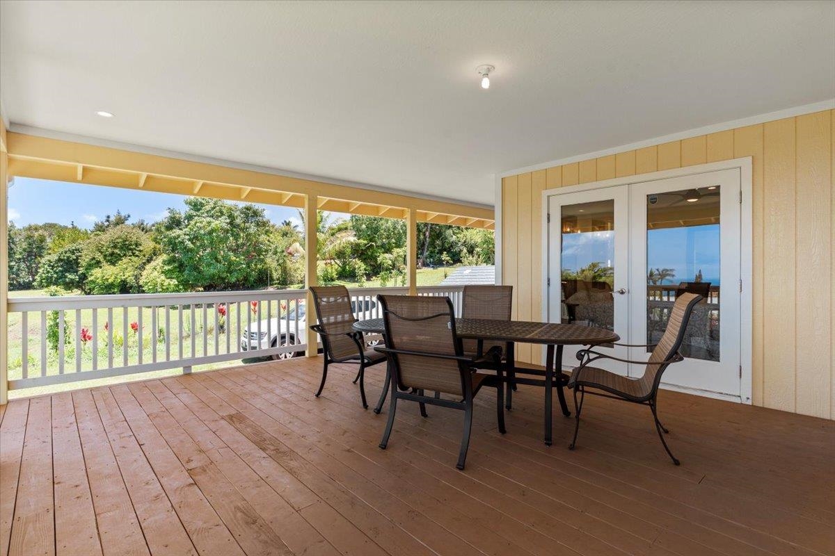 139 Pauwela Road Haiku, HI 96708 - Photo 30 of 42 a dining room with furniture and wooden floor