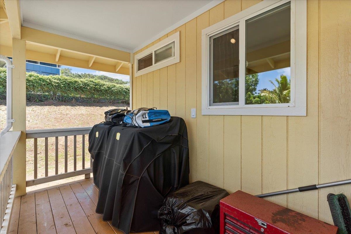 139 Pauwela Road Haiku, HI 96708 - Photo 32 of 42 a view of a balcony with chair and front door