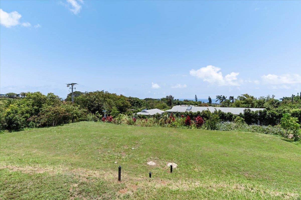 139 Pauwela Road Haiku, HI 96708 - Photo 36 of 42 a view of a lake with houses in the back