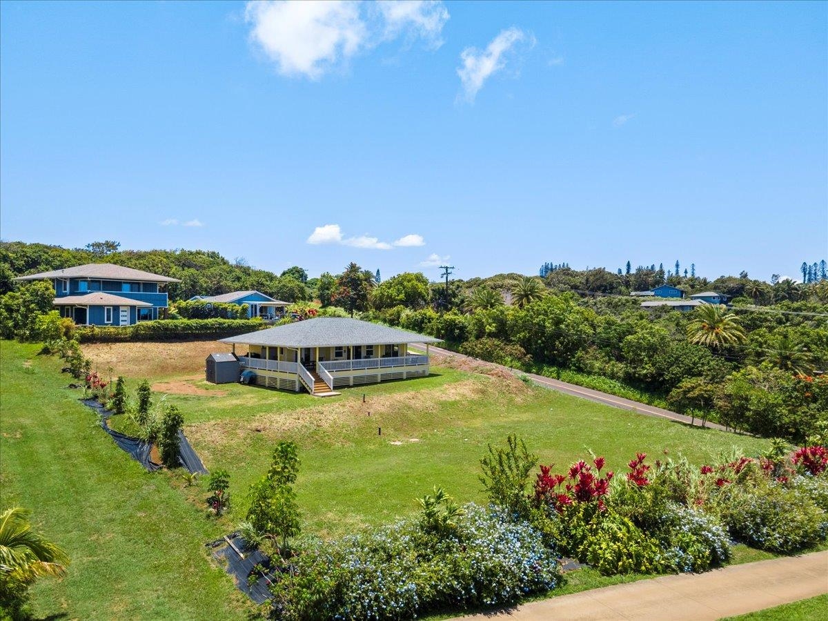 139 Pauwela Road Haiku, HI 96708 - Photo 38 of 42 a view of a house with a yard and lake view