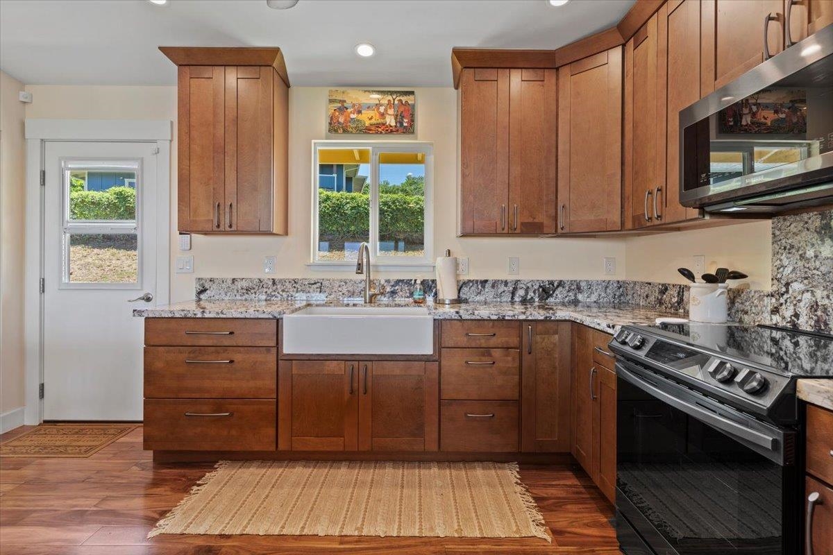 139 Pauwela Road Haiku, HI 96708 - Photo 8 of 42 a kitchen with a sink stove and microwave