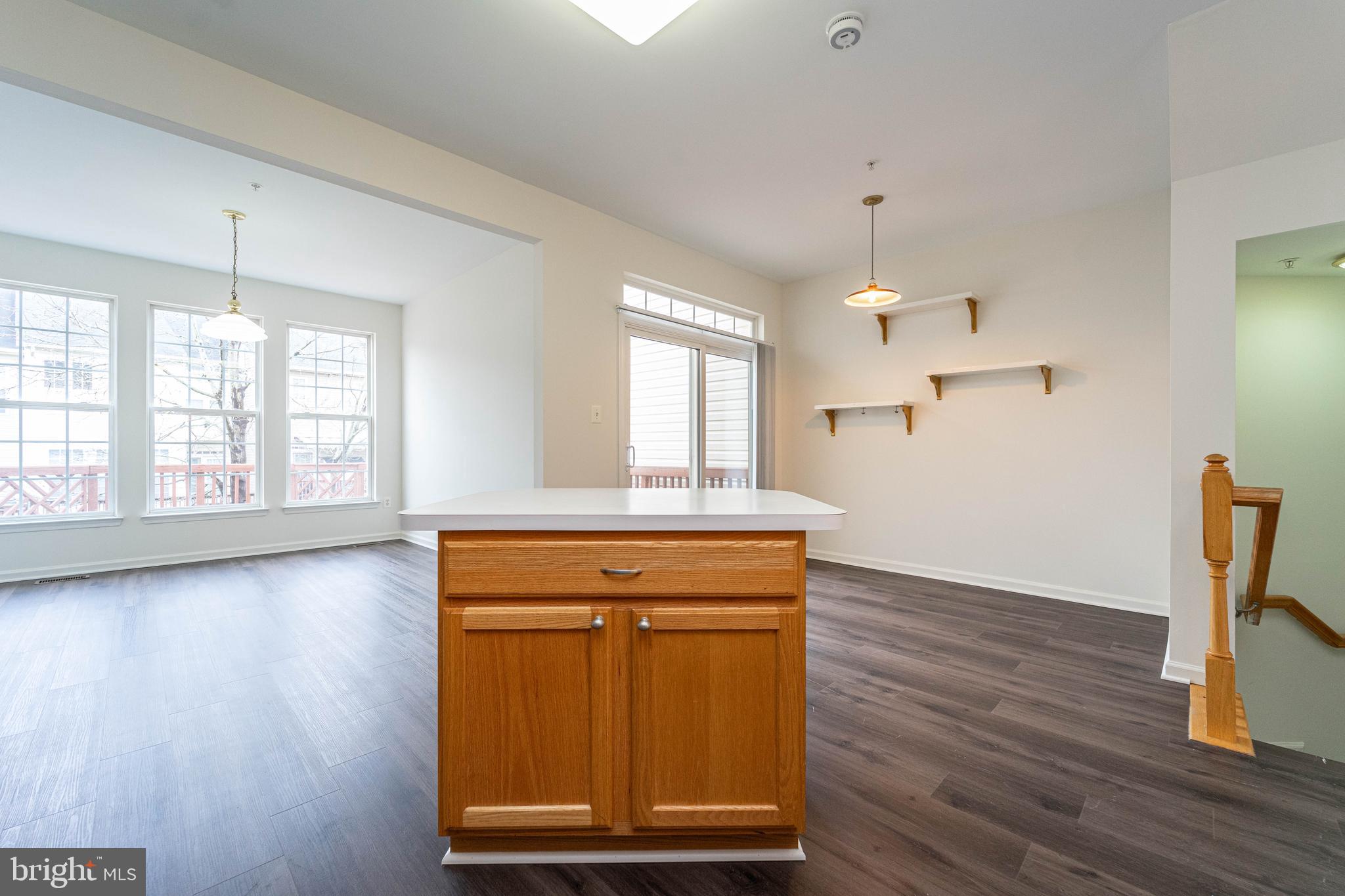 4309 Windflower Way Bowie, MD 20720 - Photo 13 of 46 a view of a kitchen with wooden floor and window