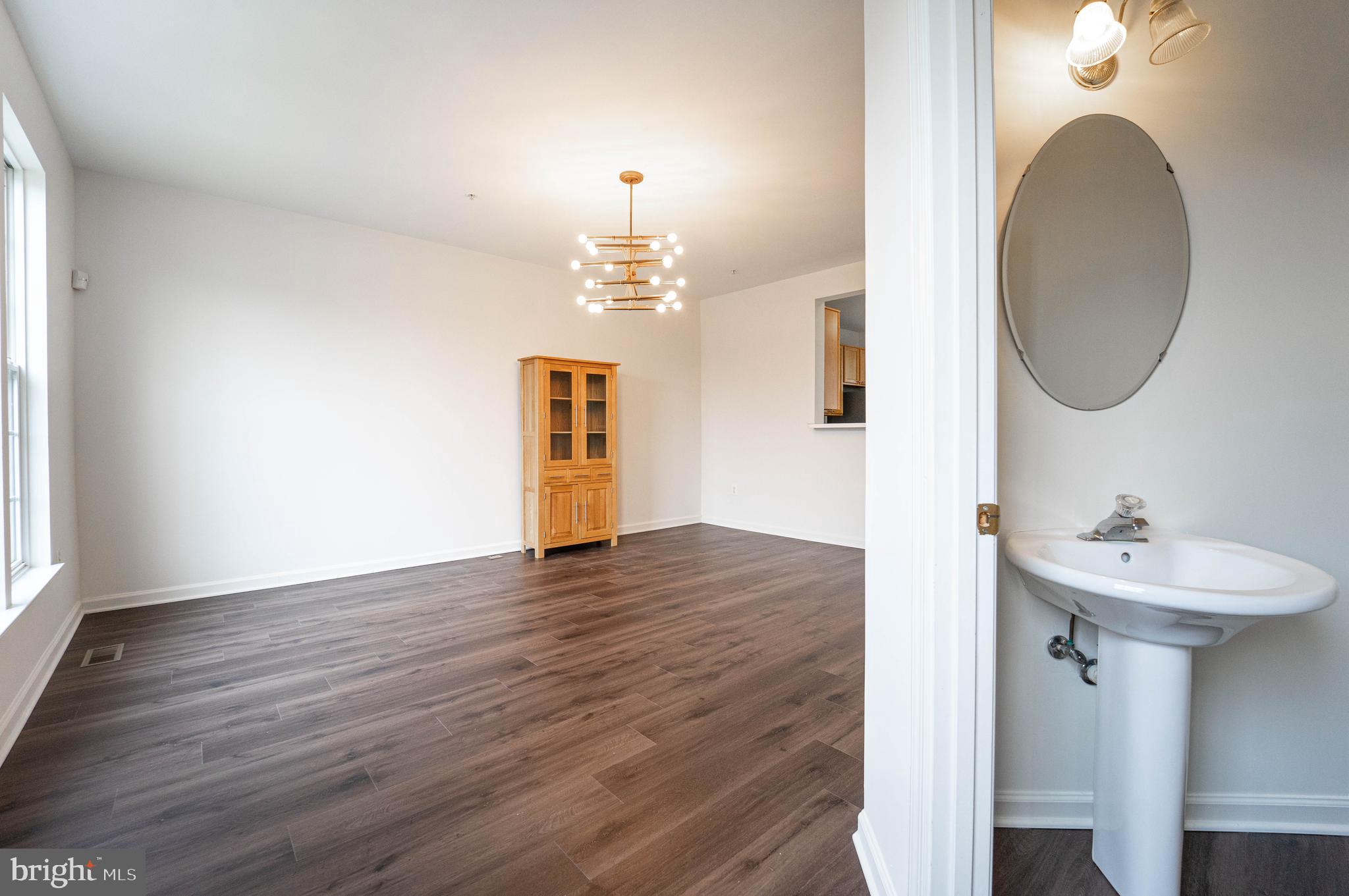 4309 Windflower Way Bowie, MD 20720 - Photo 18 of 46 a bathroom with a sink and a mirror