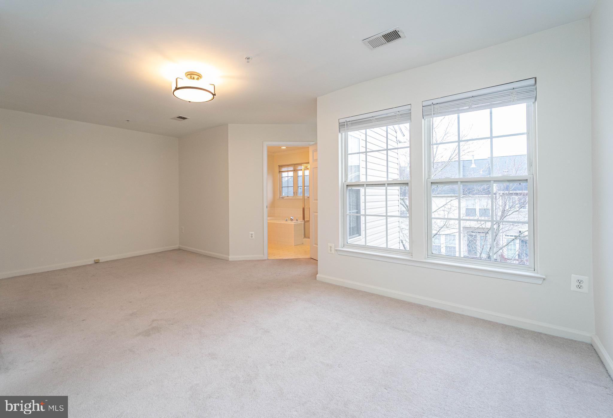 4309 Windflower Way Bowie, MD 20720 - Photo 22 of 46 an empty room with a window