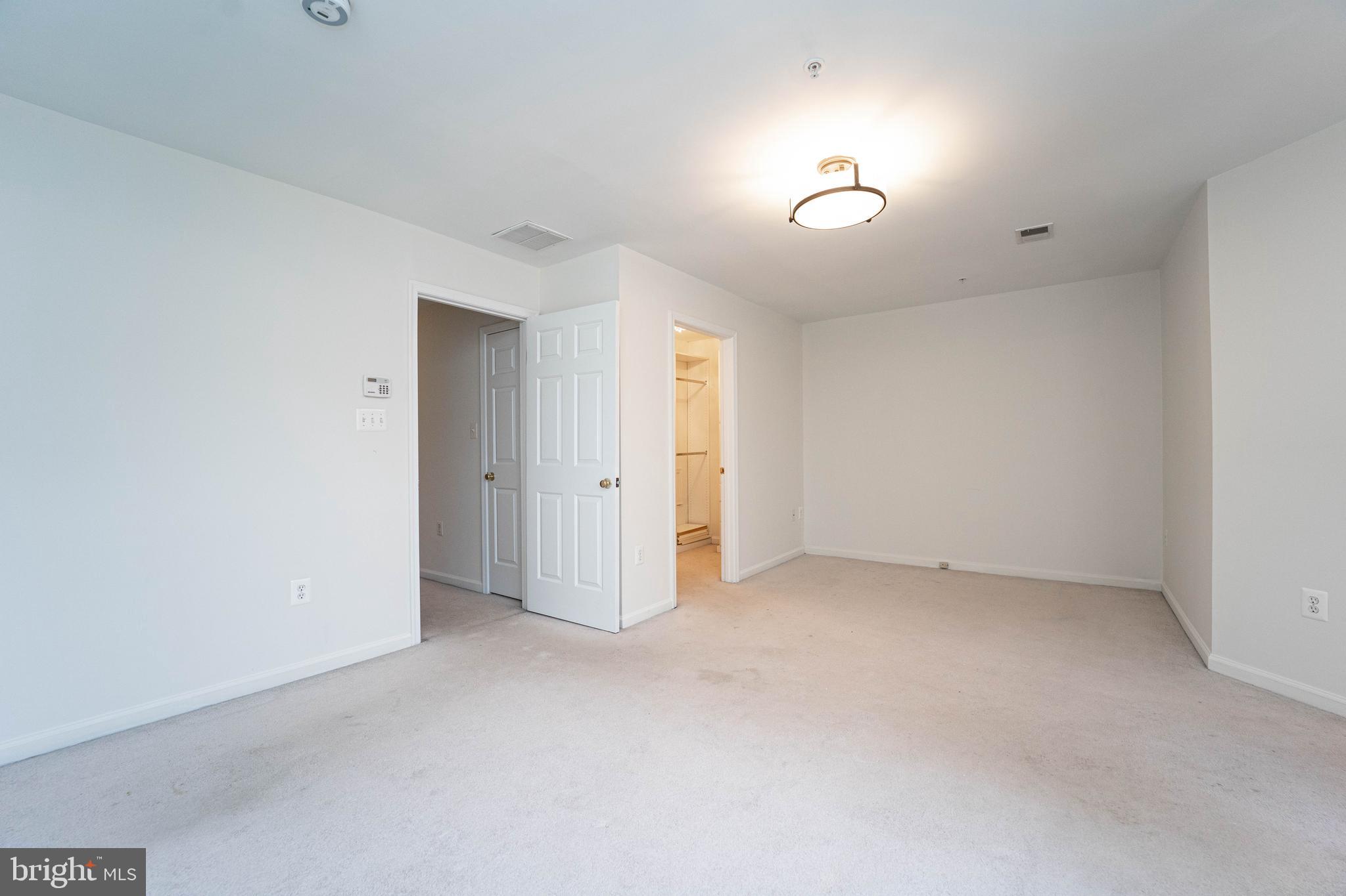 4309 Windflower Way Bowie, MD 20720 - Photo 25 of 46 an empty room with a bathroom