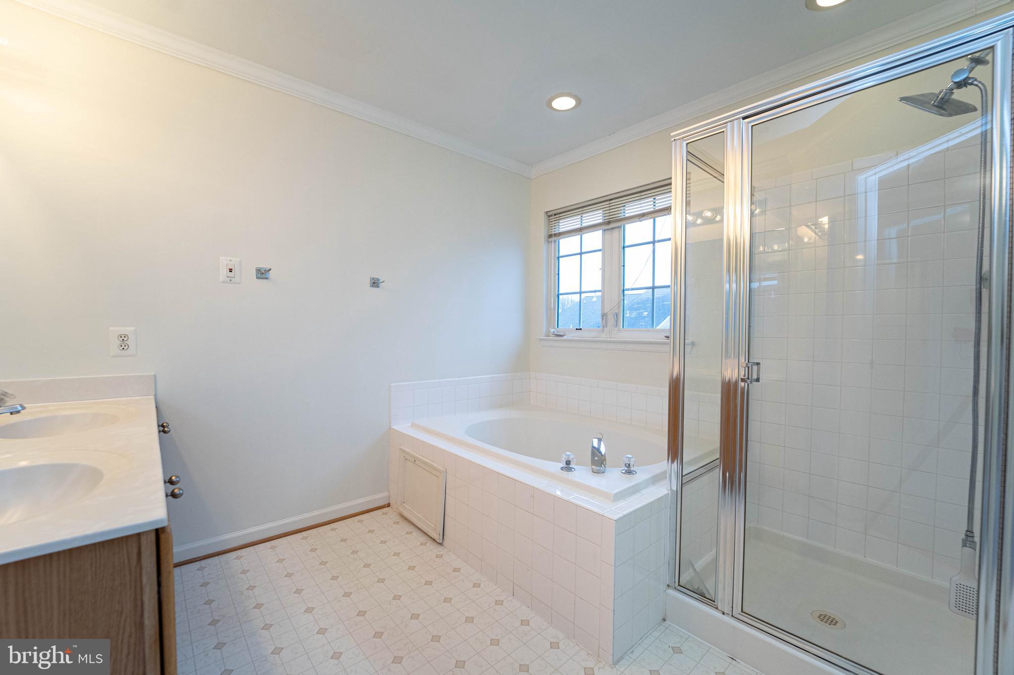 4309 Windflower Way Bowie, MD 20720 - Photo 27 of 46 a bathroom with a tub sink and shower