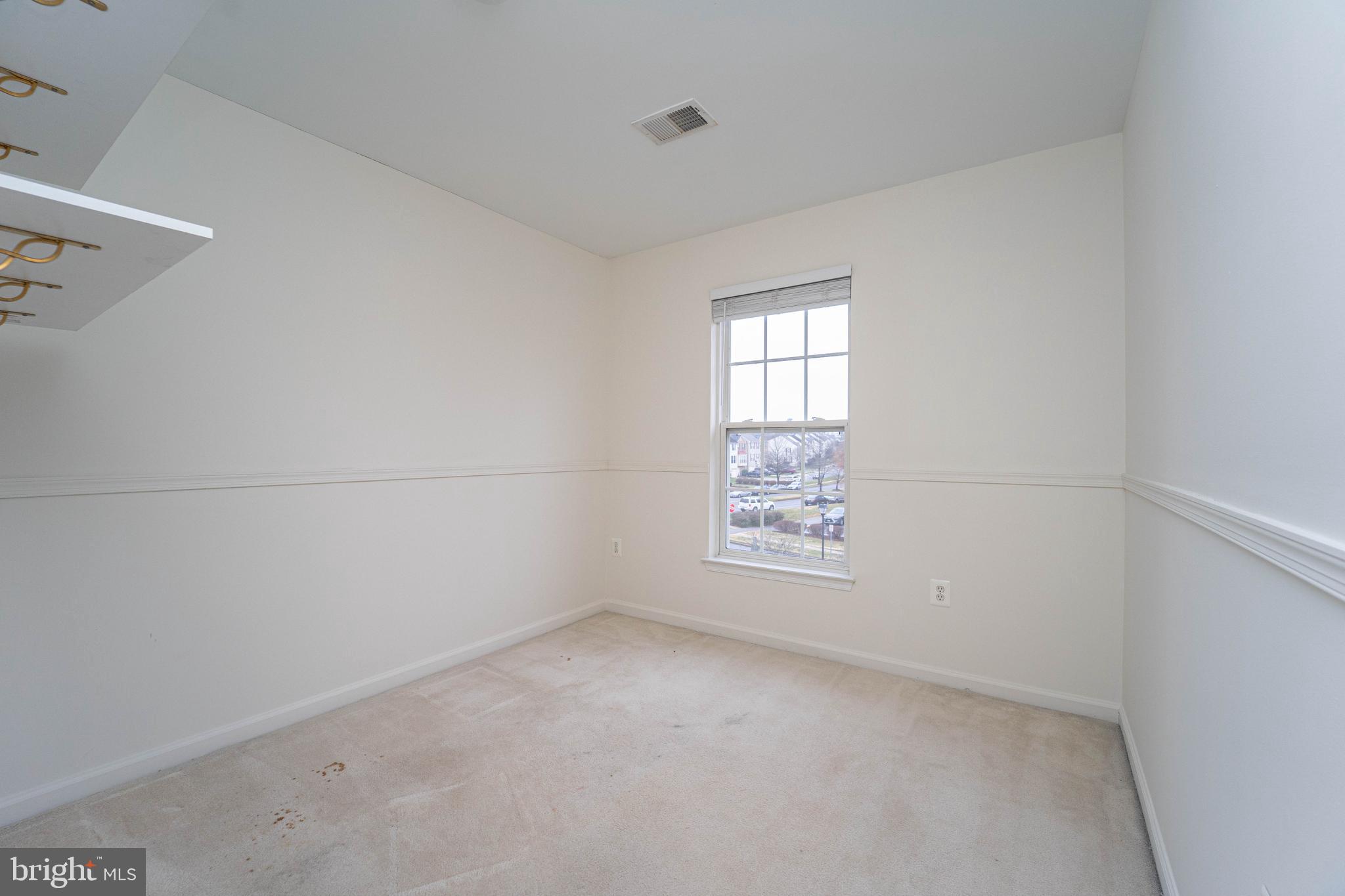4309 Windflower Way Bowie, MD 20720 - Photo 30 of 46 a view of an empty room and a window