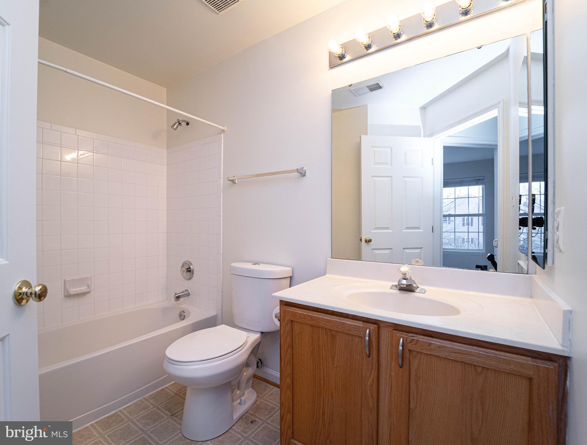 4309 Windflower Way Bowie, MD 20720 - Photo 34 of 46 a bathroom with a sink a toilet and shower