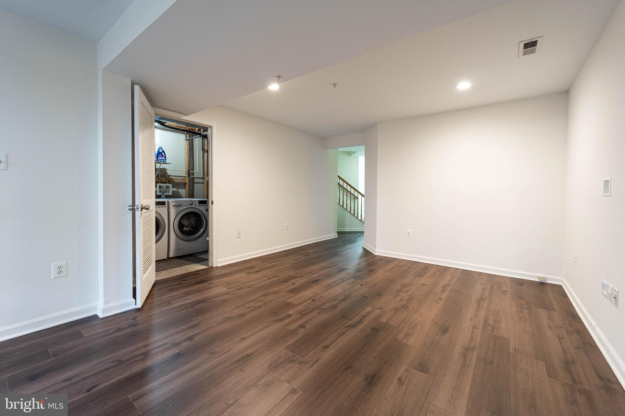 4309 Windflower Way Bowie, MD 20720 - Photo 4 of 46 an empty room with wooden floor and a window