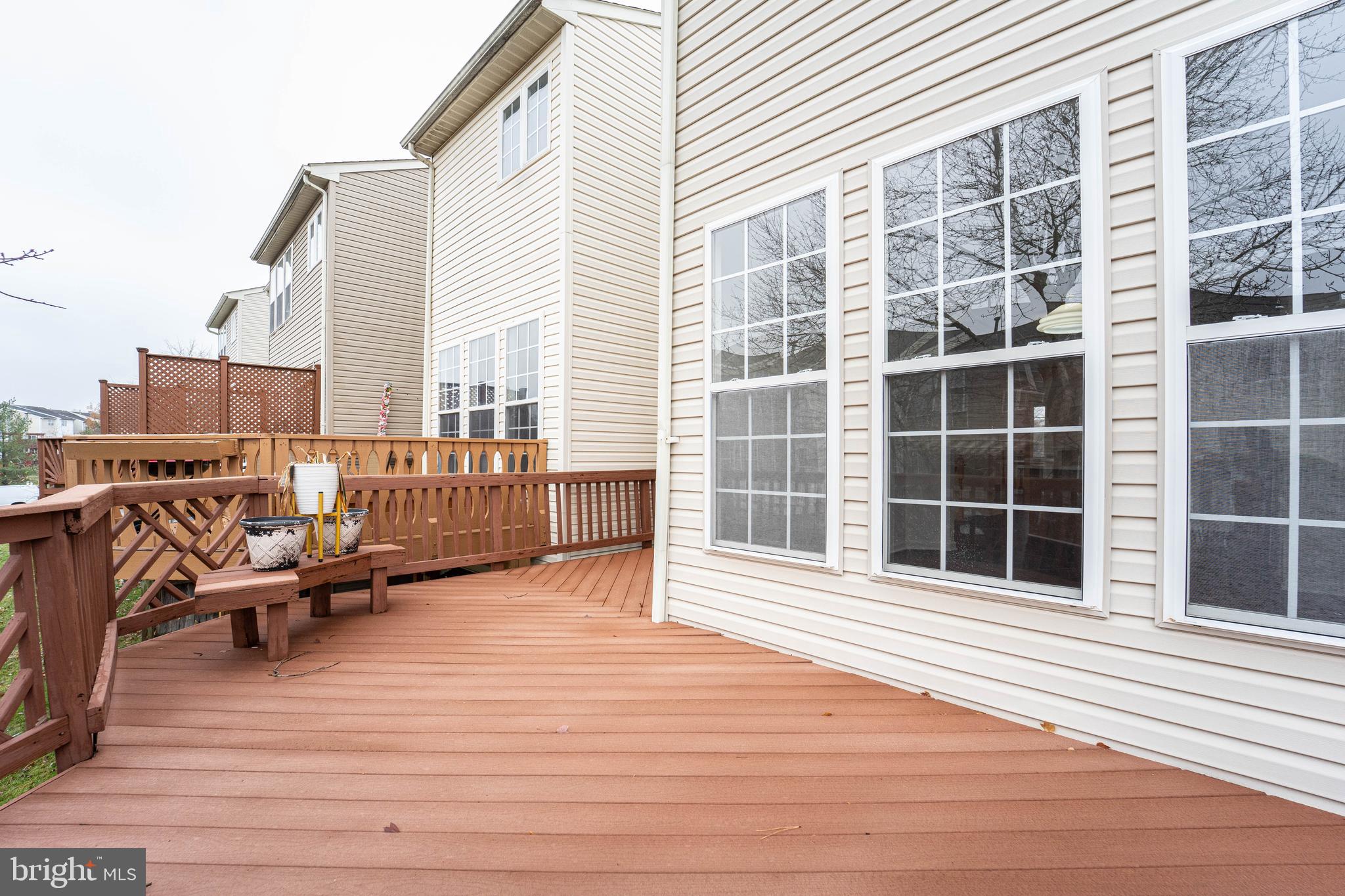 4309 Windflower Way Bowie, MD 20720 - Photo 40 of 46 a balcony with wooden floor and furniture