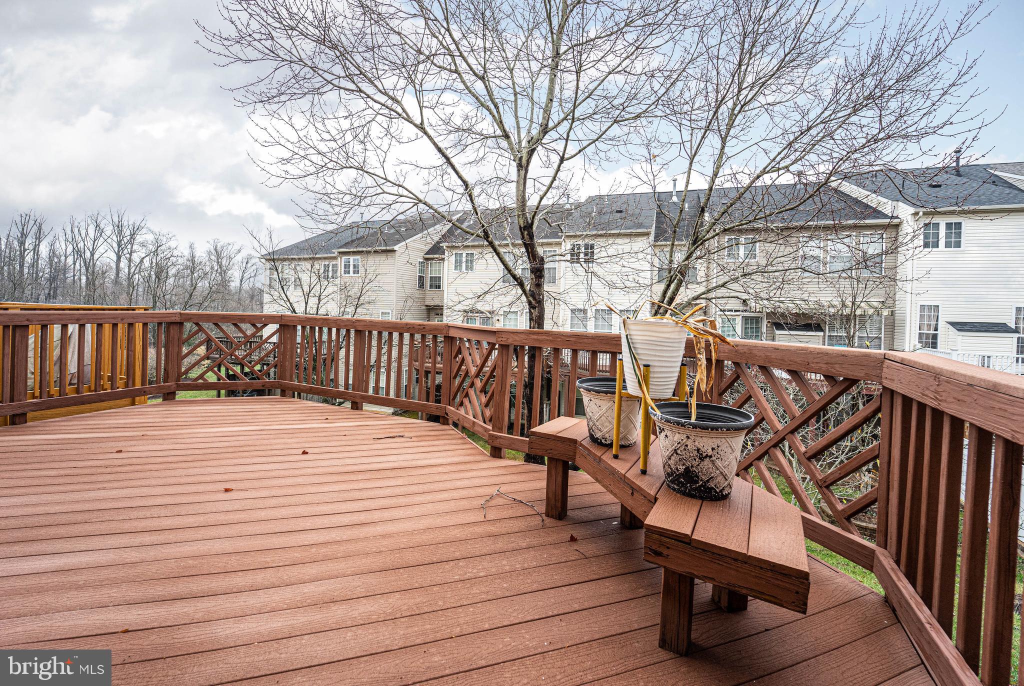 4309 Windflower Way Bowie, MD 20720 - Photo 41 of 46 a wooden bench sitting on top of a wooden floor