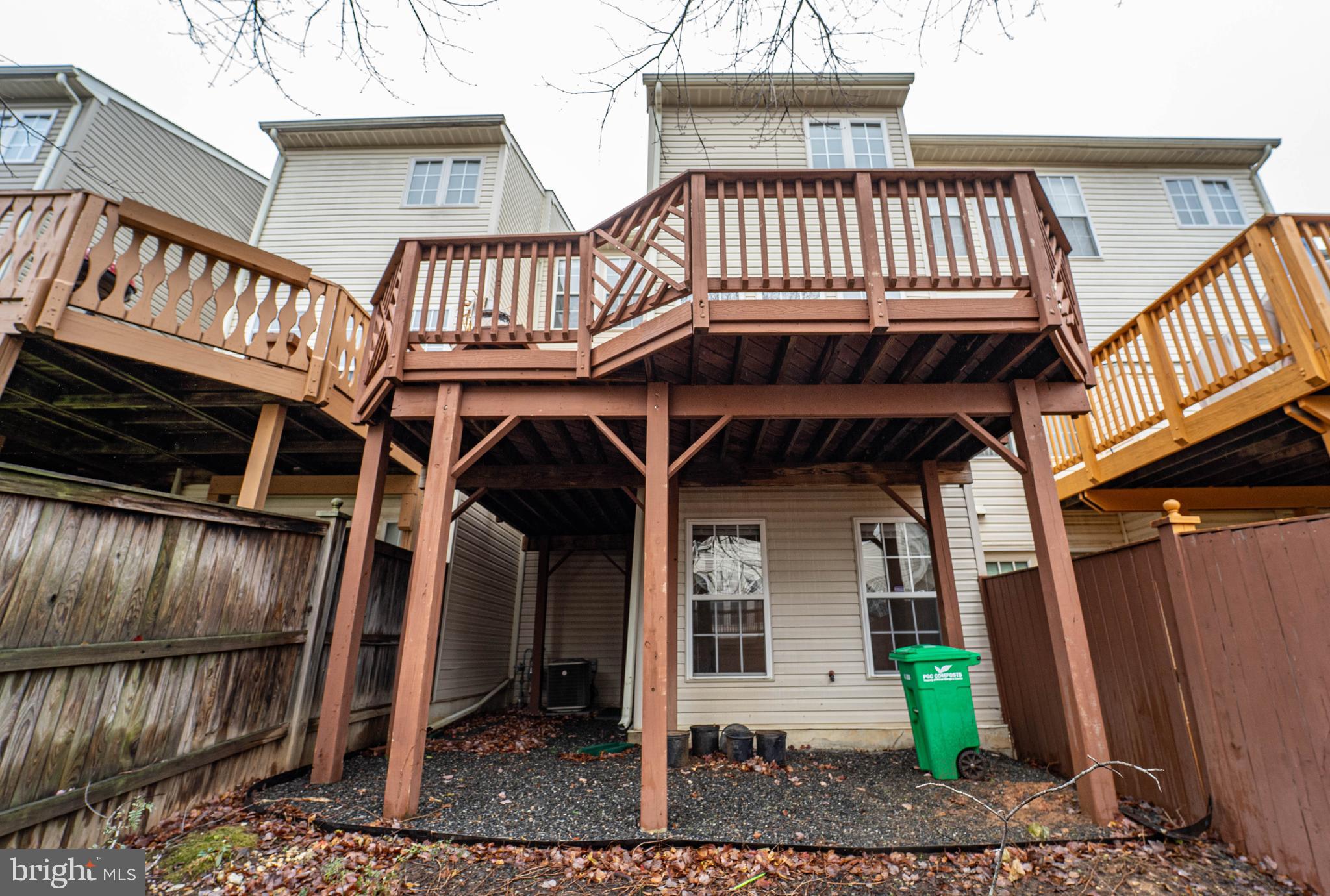 4309 Windflower Way Bowie, MD 20720 - Photo 43 of 46 a view of a porch with furniture and floor to ceiling window and wooden floor