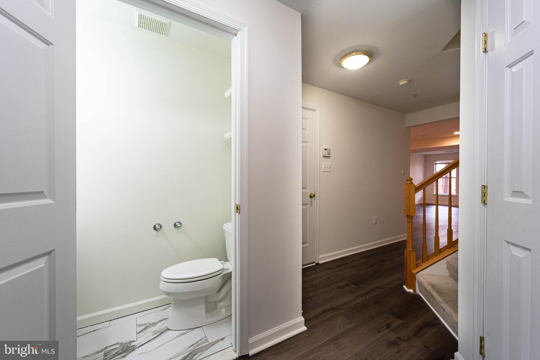 4309 Windflower Way Bowie, MD 20720 - Photo 6 of 46 a bathroom with a toilet and a shower
