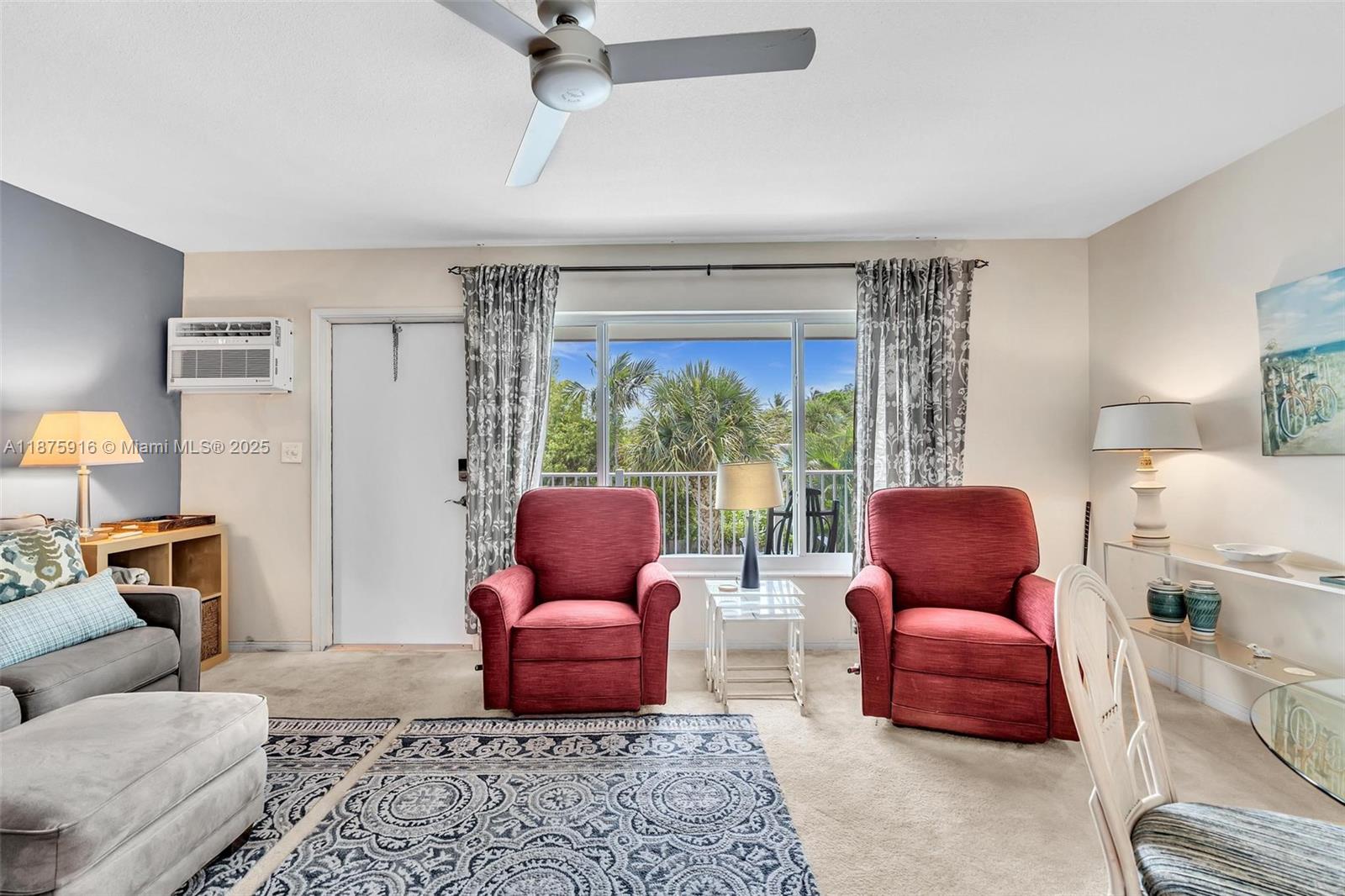 2501 North Ocean Boulevard, Unit 18 Pompano Beach, FL 33062 - Photo 11 of 36 a living room with furniture and a large window