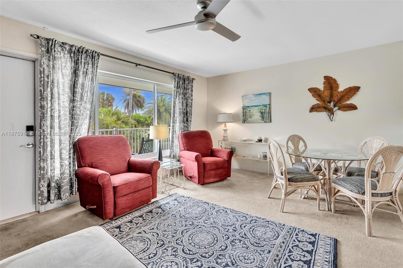 2501 North Ocean Boulevard, Unit 18 Pompano Beach, FL 33062 - Photo 12 of 36 a living room with furniture or couch and a window