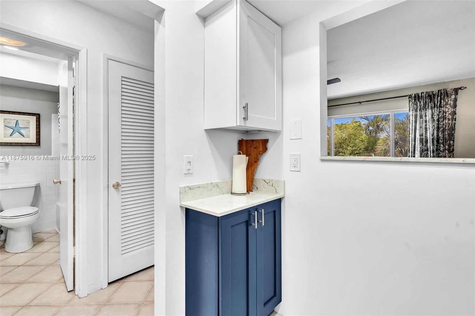 2501 North Ocean Boulevard, Unit 18 Pompano Beach, FL 33062 - Photo 19 of 36 a bathroom with a sink a toilet and vanity