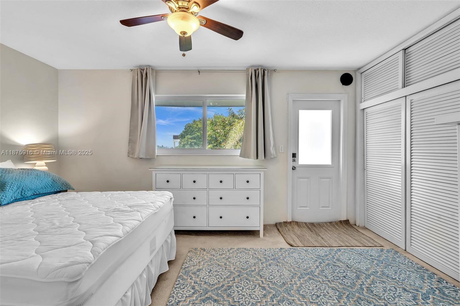 2501 North Ocean Boulevard, Unit 18 Pompano Beach, FL 33062 - Photo 22 of 36 a bedroom with a bed and a dresser