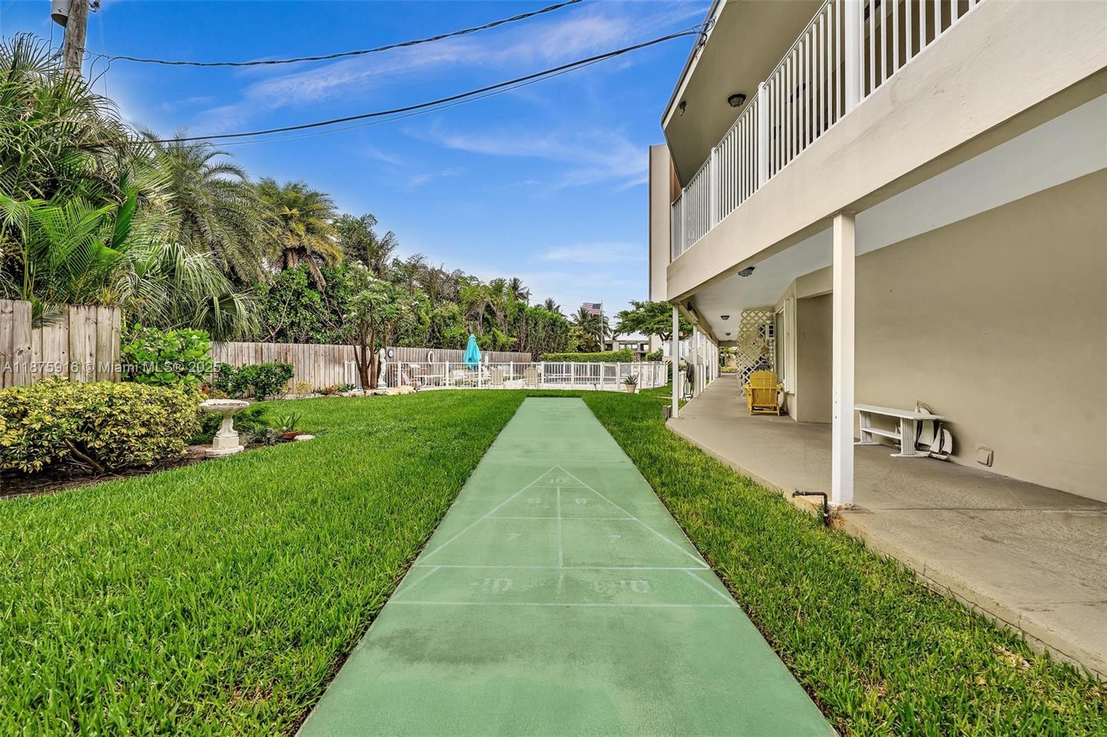 2501 North Ocean Boulevard, Unit 18 Pompano Beach, FL 33062 - Photo 30 of 36 a view of building with garden