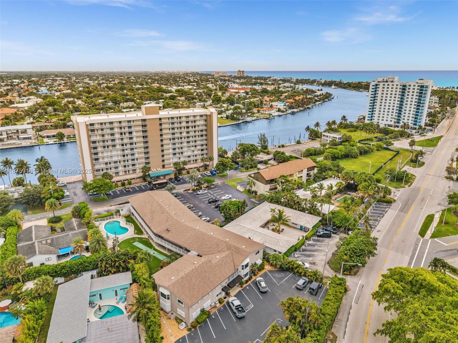 2501 North Ocean Boulevard, Unit 18 Pompano Beach, FL 33062 - Photo 3 of 36 an aerial view of residential building and lake