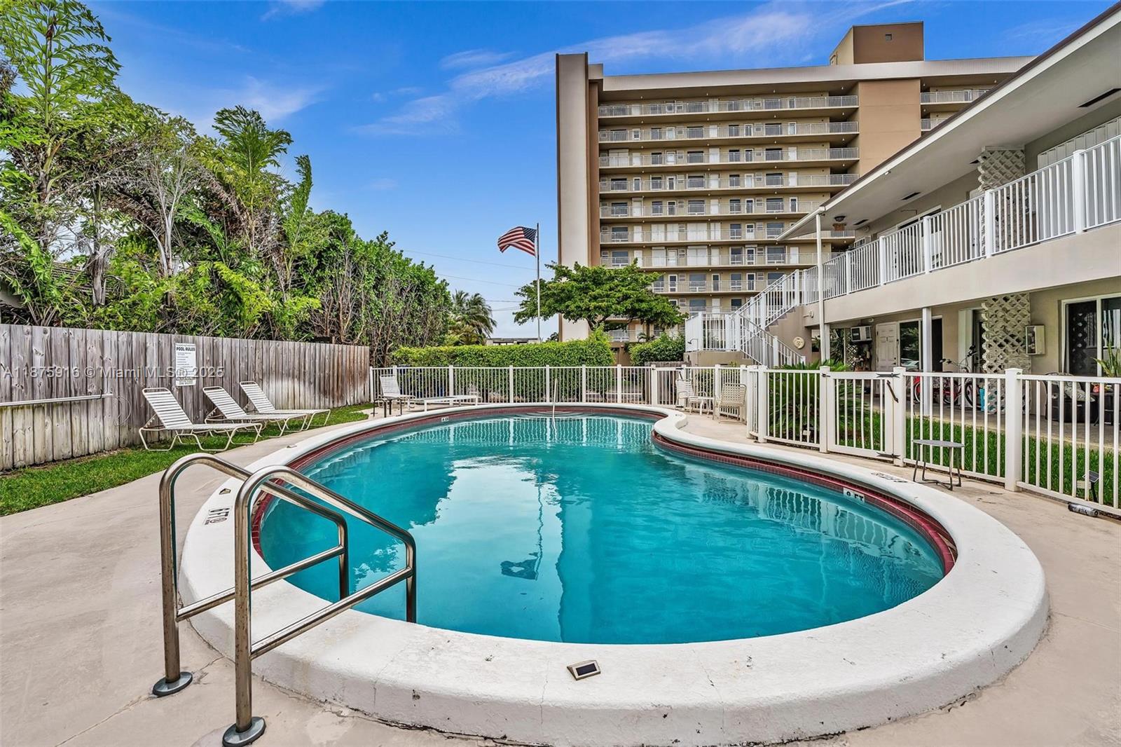 2501 North Ocean Boulevard, Unit 18 Pompano Beach, FL 33062 - Photo 32 of 36 a view of a swimming pool with a patio
