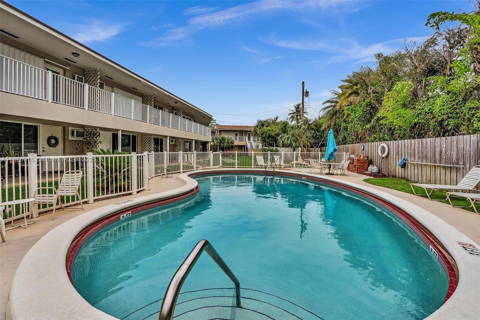 2501 North Ocean Boulevard, Unit 18 Pompano Beach, FL 33062 - Photo 33 of 36 a view of a house with swimming pool
