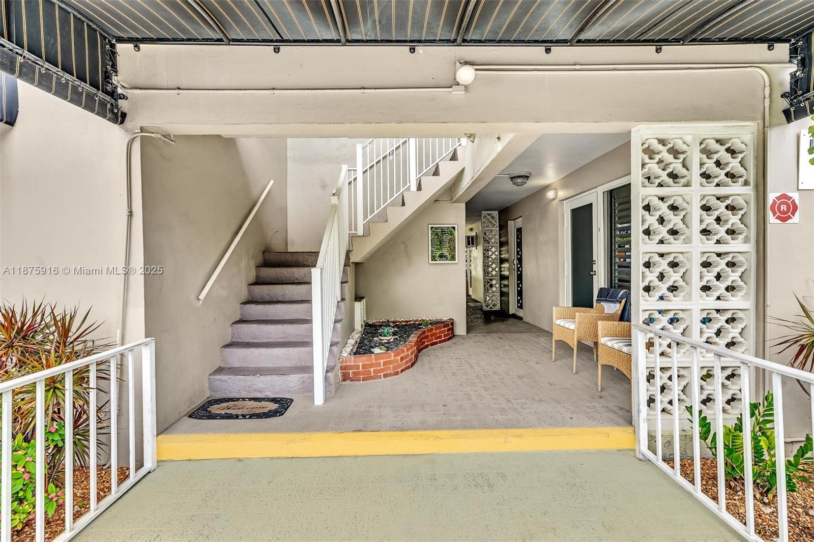 2501 North Ocean Boulevard, Unit 18 Pompano Beach, FL 33062 - Photo 34 of 36 a view of a house with entryway and stairs