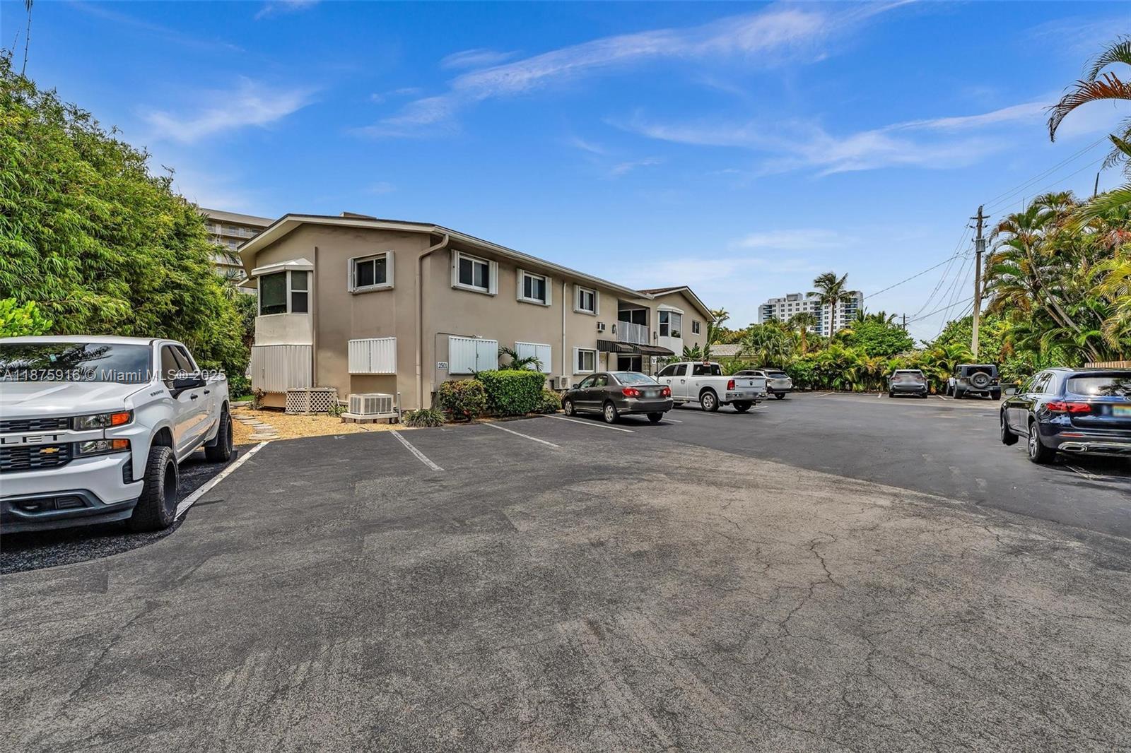 2501 North Ocean Boulevard, Unit 18 Pompano Beach, FL 33062 - Photo 35 of 36 a car parked in front of a house