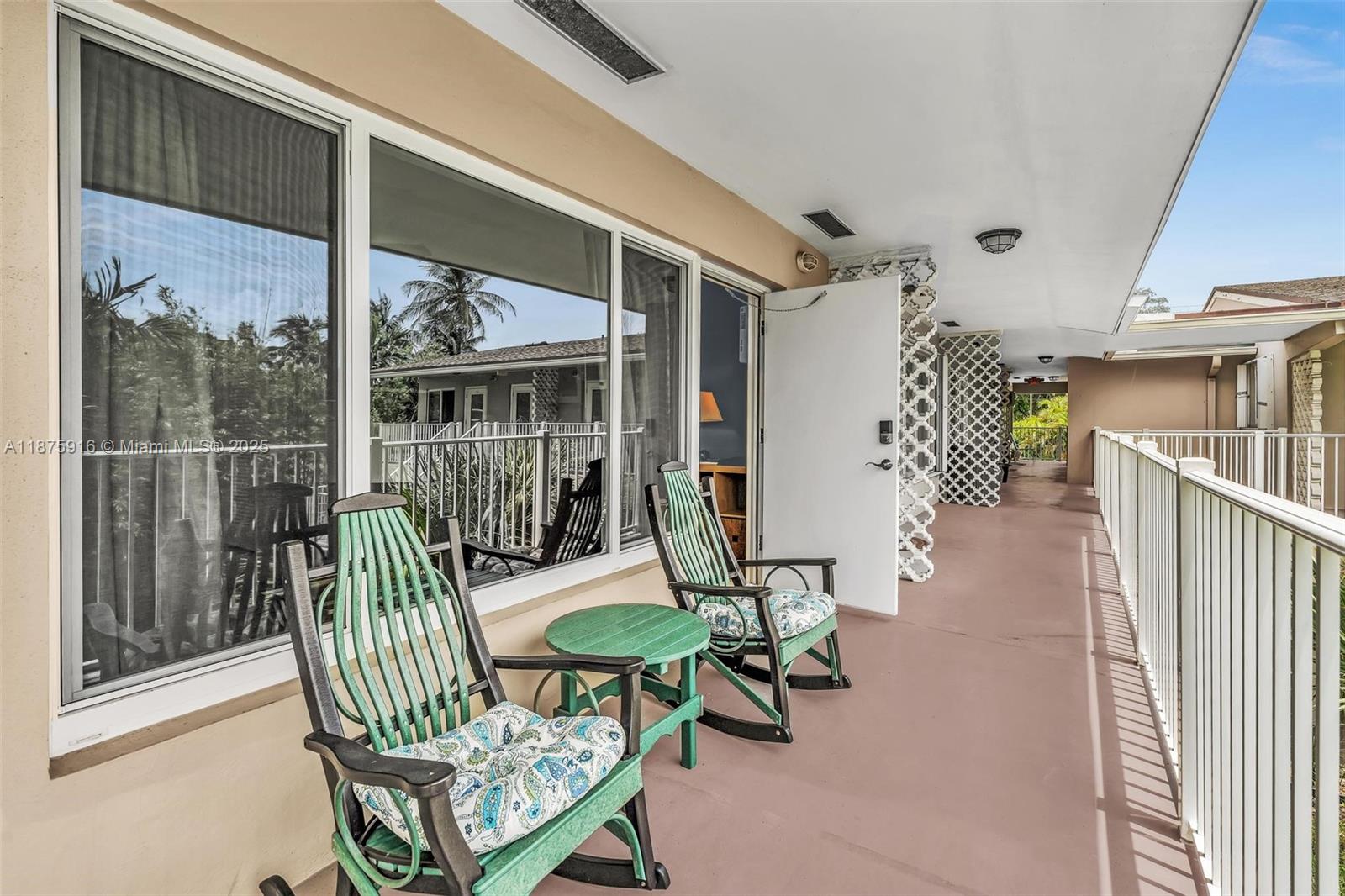 2501 North Ocean Boulevard, Unit 18 Pompano Beach, FL 33062 - Photo 10 of 36 a view of a porch with chairs and backyard