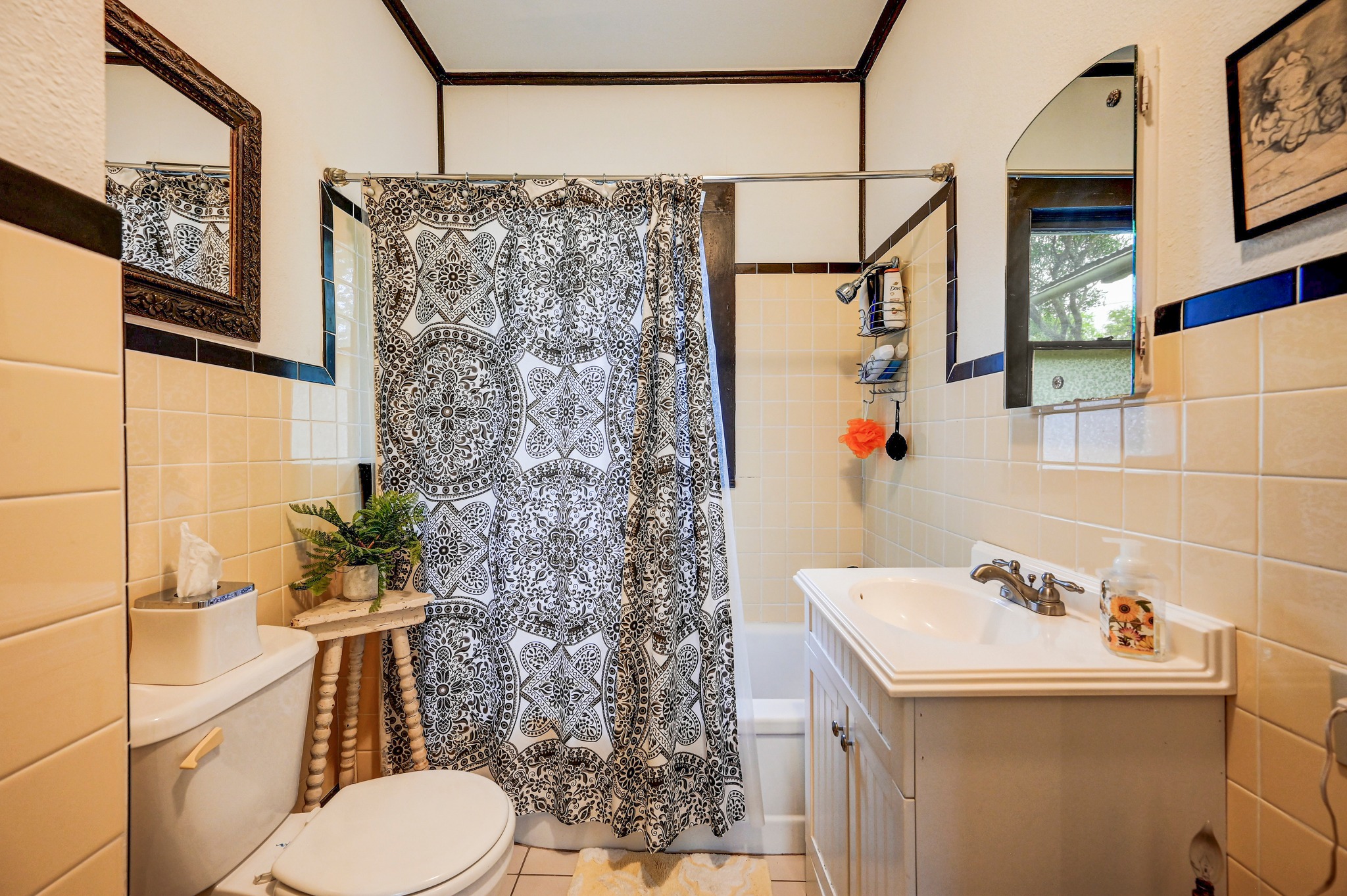 719 Elm Street Blanco, TX 78606 - Photo 19 of 25 Bathroom featuring a white vanity with integrated sink, chrome faucet, and storage cabinetry