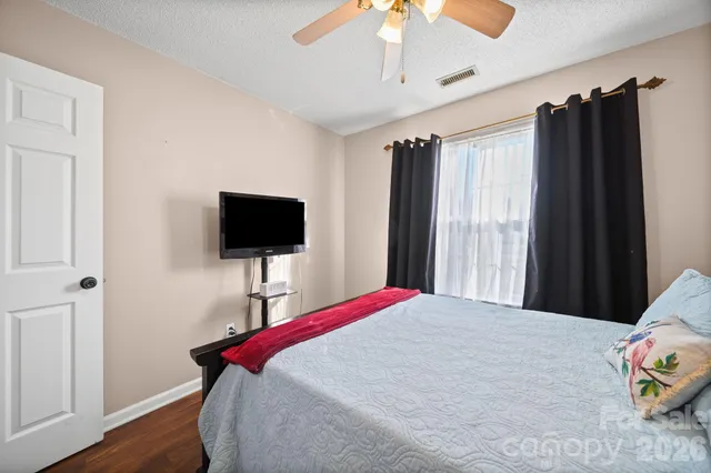 a spacious bathroom with a double vanity sink and a mirror