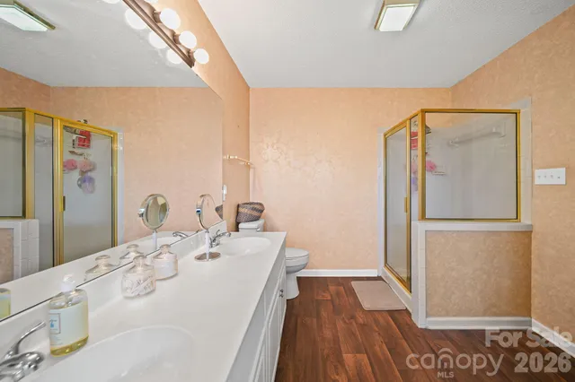 a view of a field with trees in background