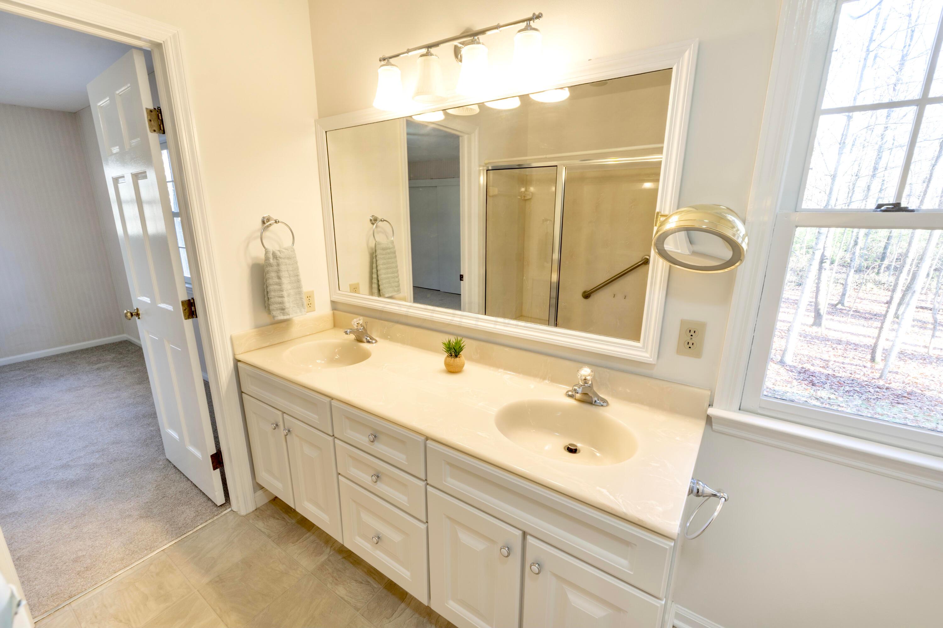 3880 Fry Road Ostrander, OH 43061 - Photo 49 of 82 This spacious bathroom has a walk-in shower with seat. Window overlooks the backyard.