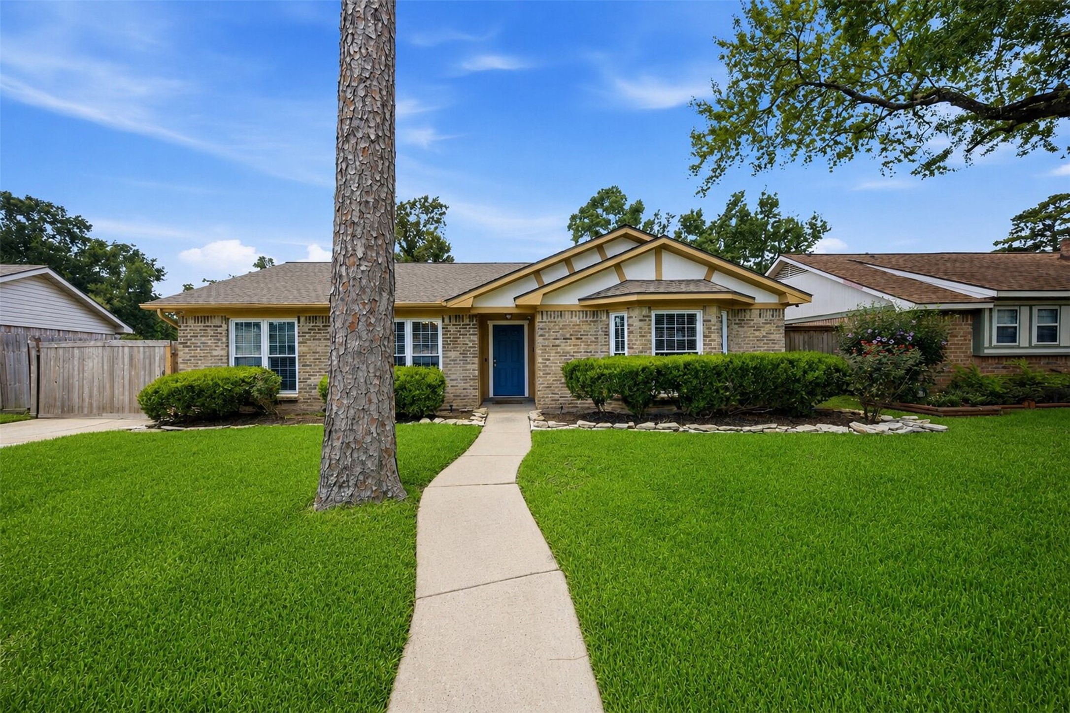 24015 Spring Mill Lane Spring, TX 77373 - Photo 6 of 49 Beautiful front elevation welcomes guests with mature landscaping and exceptional curb appeal.