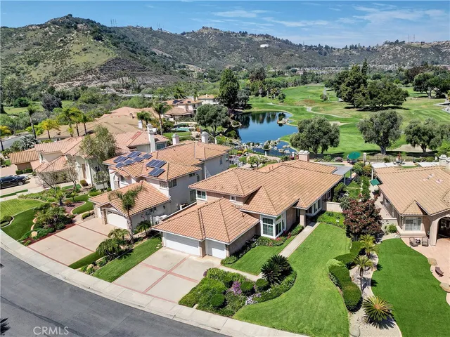 an aerial view of a house with mountain view