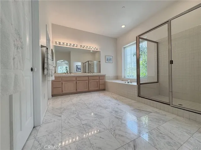 a view of an empty room with a fireplace and a vanity
