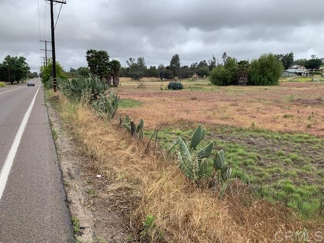 1669 Montecito Road Ramona, CA 92065 - Photo 4 of 9 a view of a dry yard with trees