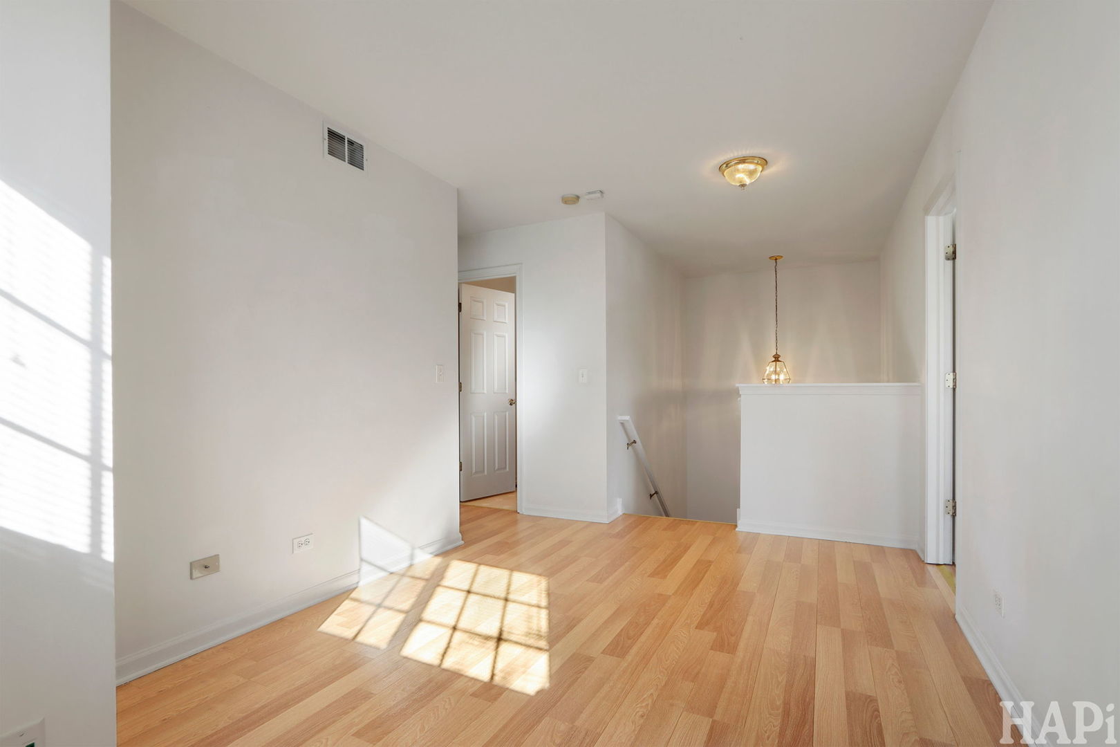 373 Keswick Court, Unit 373 Round Lake, IL 60073 - Photo 11 of 30 a view of empty room with wooden floor