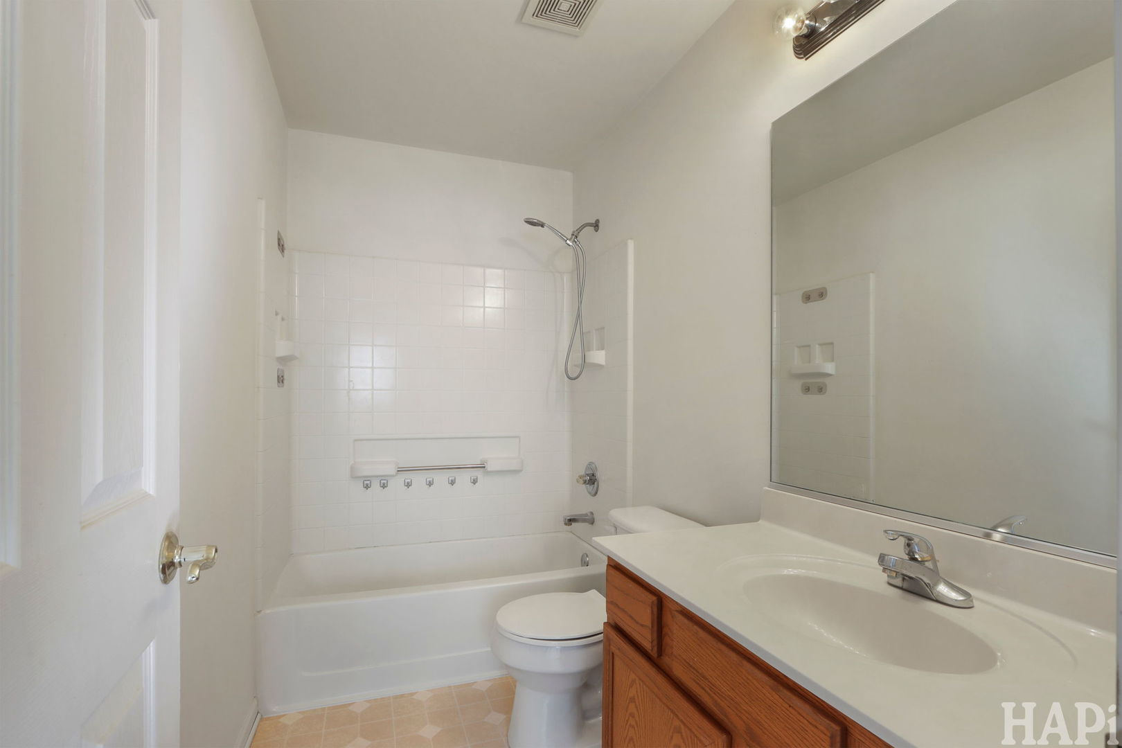 373 Keswick Court, Unit 373 Round Lake, IL 60073 - Photo 18 of 30 a bathroom with a sink a toilet and shower
