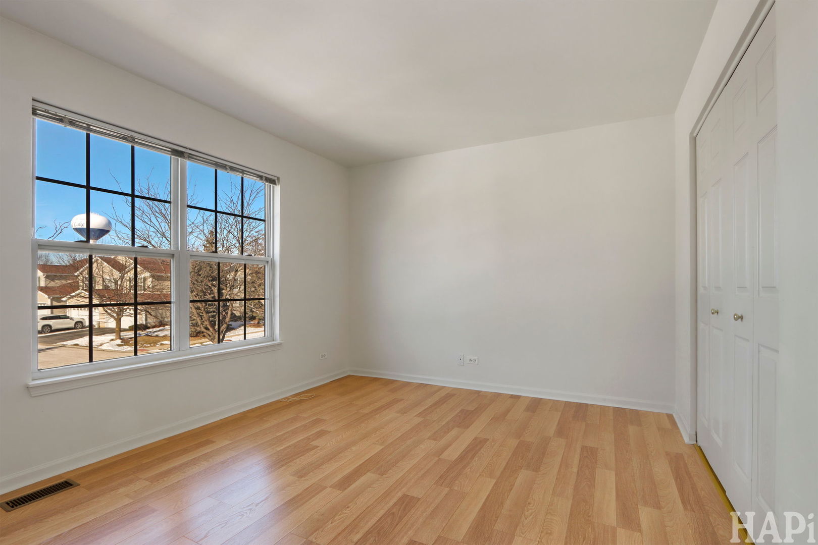 373 Keswick Court, Unit 373 Round Lake, IL 60073 - Photo 19 of 30 a view of an empty room with a window