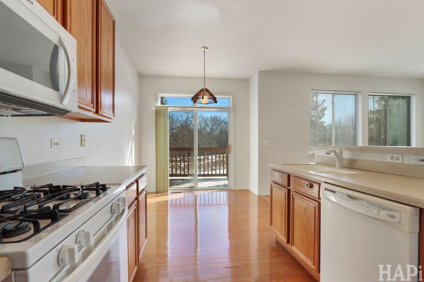 373 Keswick Court, Unit 373 Round Lake, IL 60073 - Photo 7 of 30 a kitchen with a stove and a sink