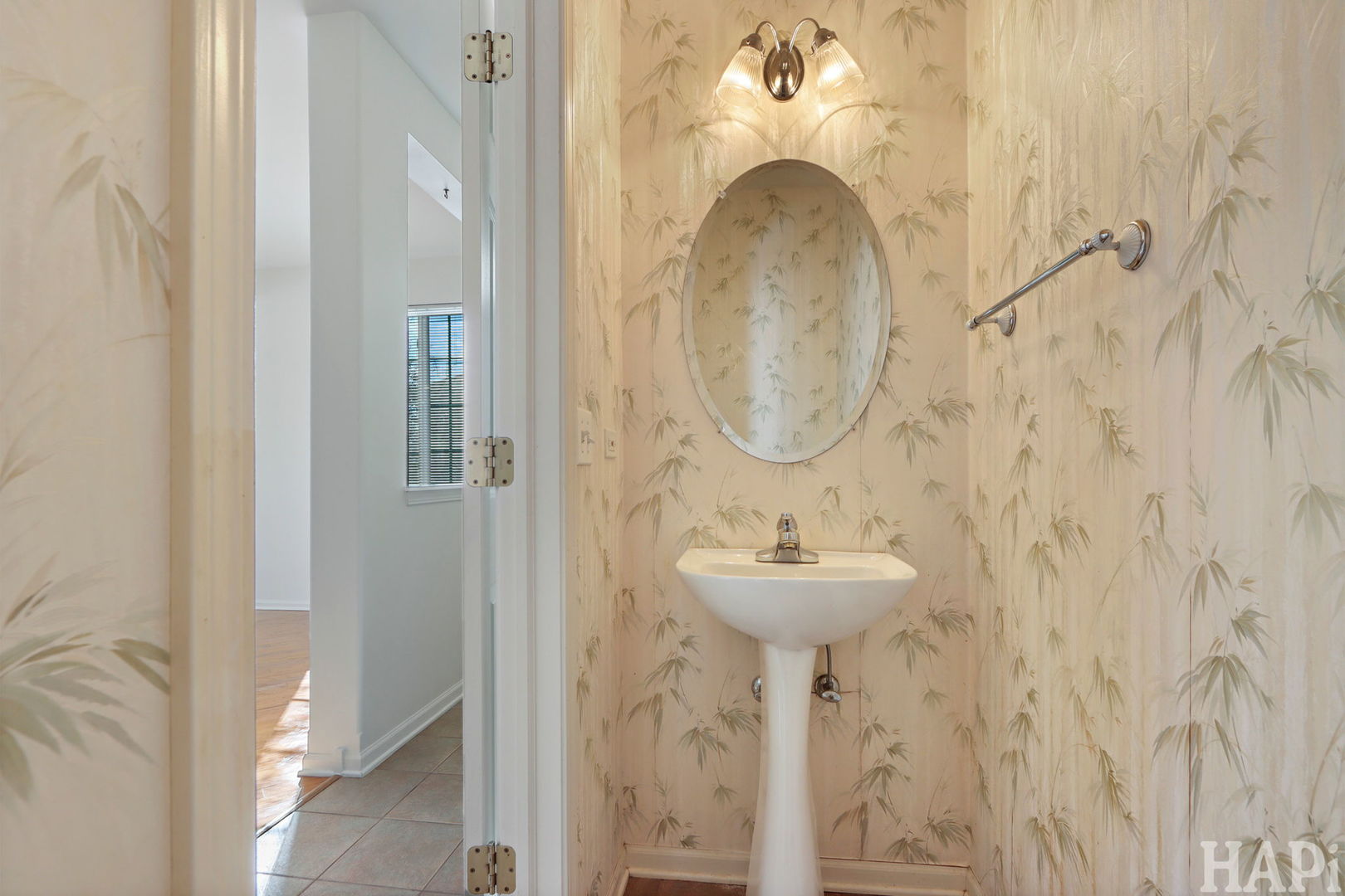 373 Keswick Court, Unit 373 Round Lake, IL 60073 - Photo 10 of 30 a bathroom with a sink a mirror and a light fixture