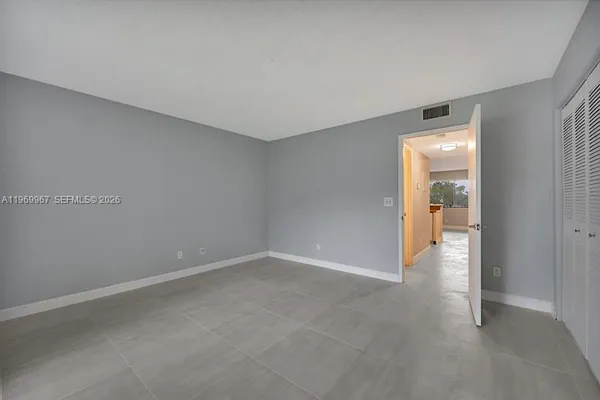 a view of an empty room and window