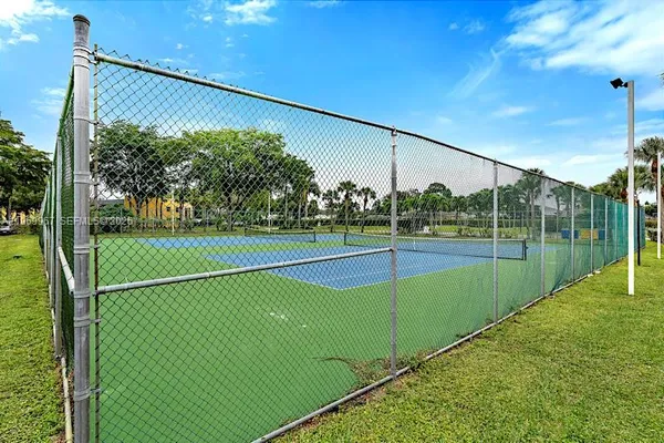 a view of a balcony with yard