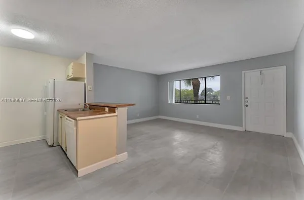 a view of a room with utility room and windows