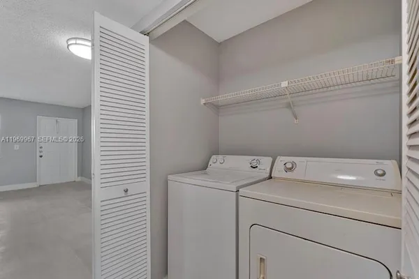 a utility room with dryer and washer