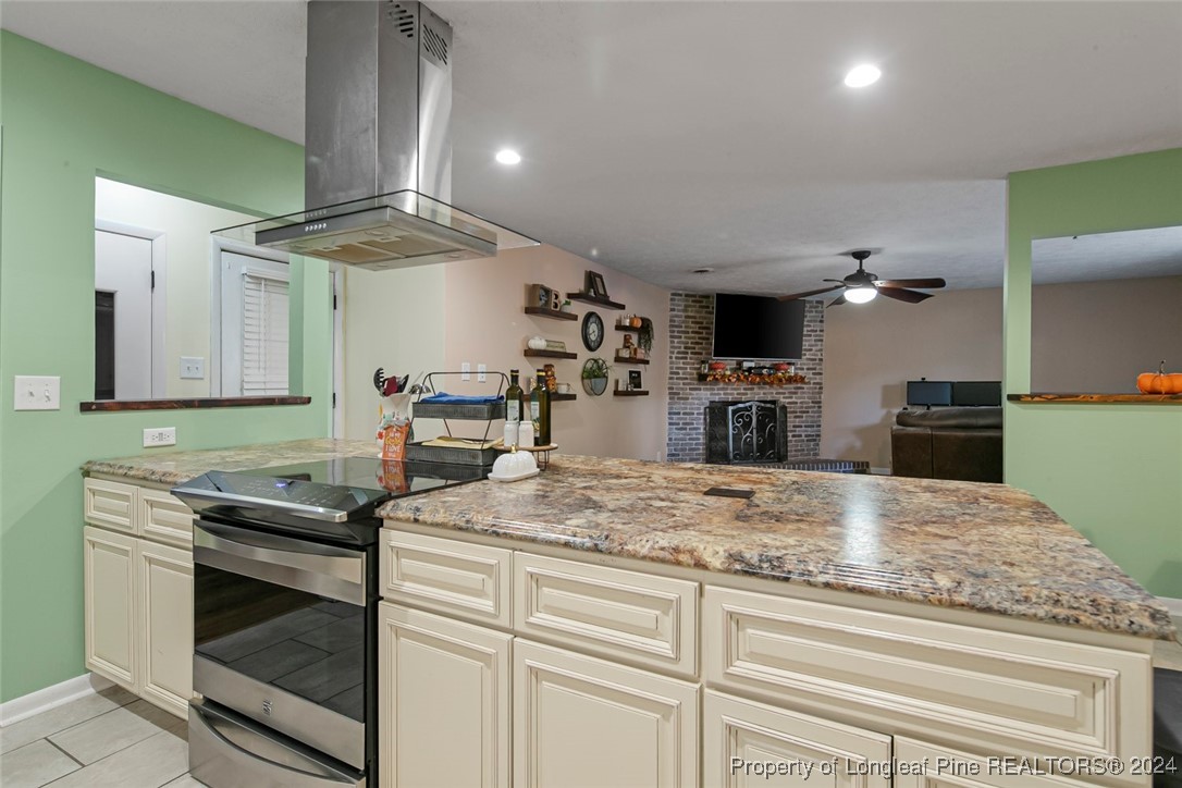 3009 Rouse Road Fayetteville, NC 28306 - Photo 11 of 37 a kitchen with sink cabinets and stainless steel appliances