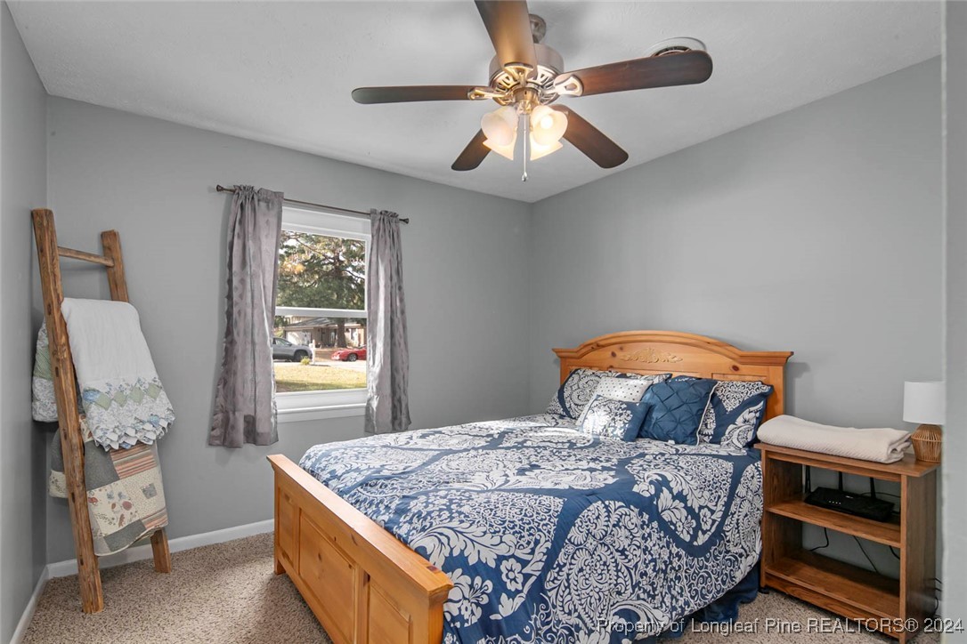 3009 Rouse Road Fayetteville, NC 28306 - Photo 20 of 37 a bedroom with a bed and a window