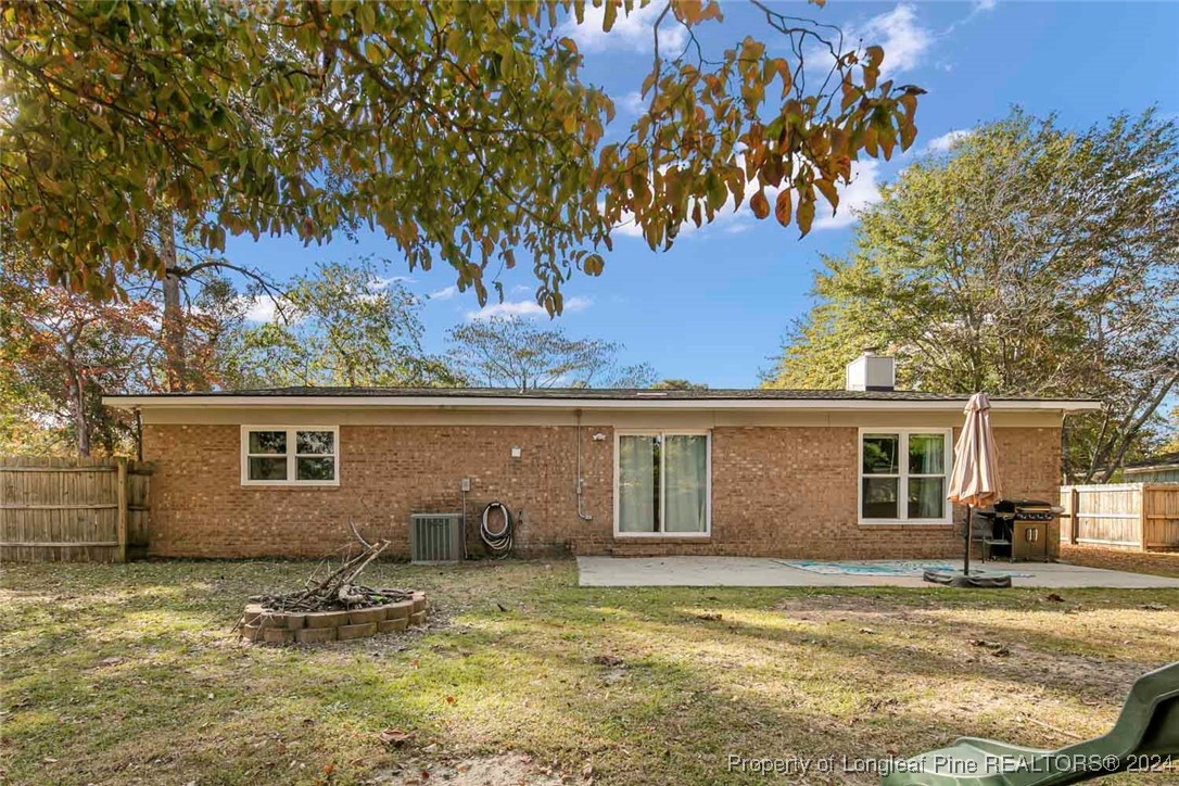 3009 Rouse Road Fayetteville, NC 28306 - Photo 2 of 37 a view of a house with a backyard